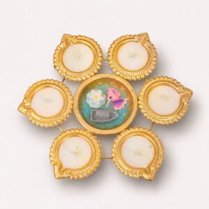 Ornate gold diya flower centerpiece